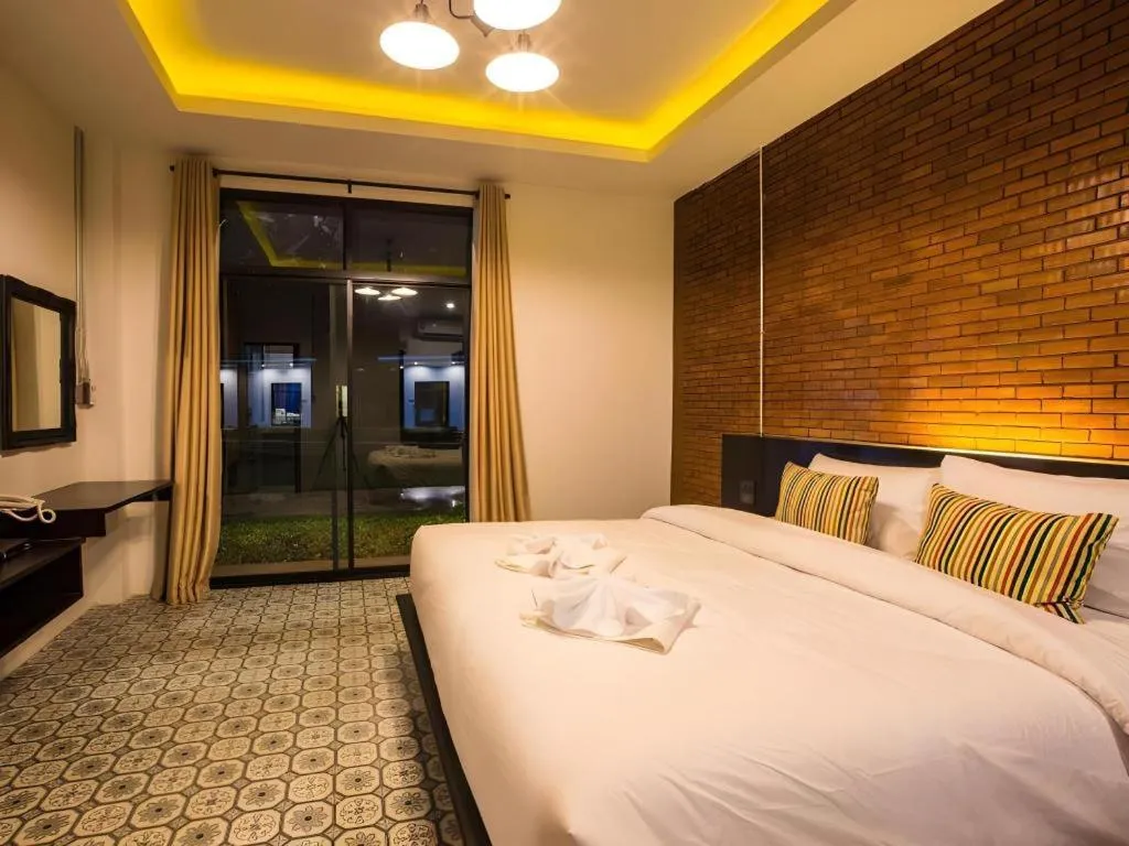 Bed in M Boutique Resort