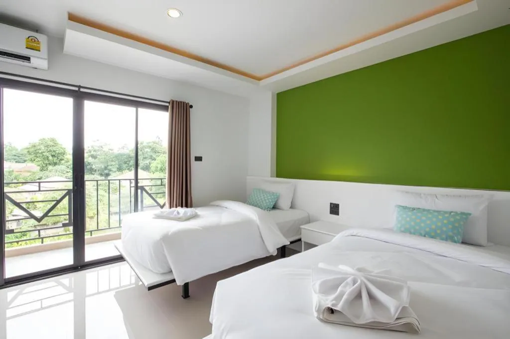 Bed in M Boutique Resort