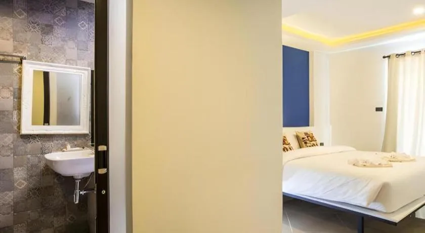 Bed in M Boutique Resort