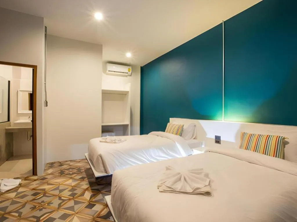 Bed in M Boutique Resort