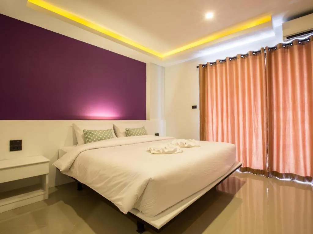 Bed in M Boutique Resort