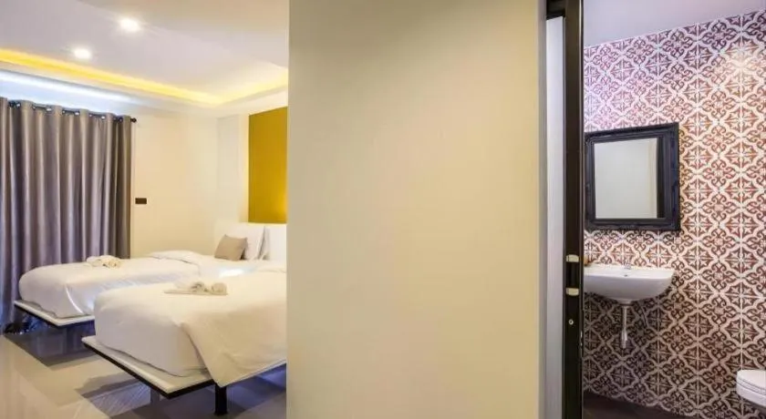 Bed in M Boutique Resort