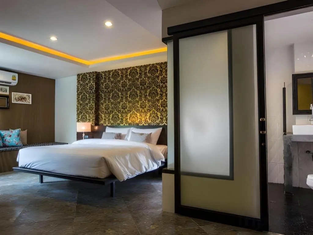 Bed in M Boutique Resort