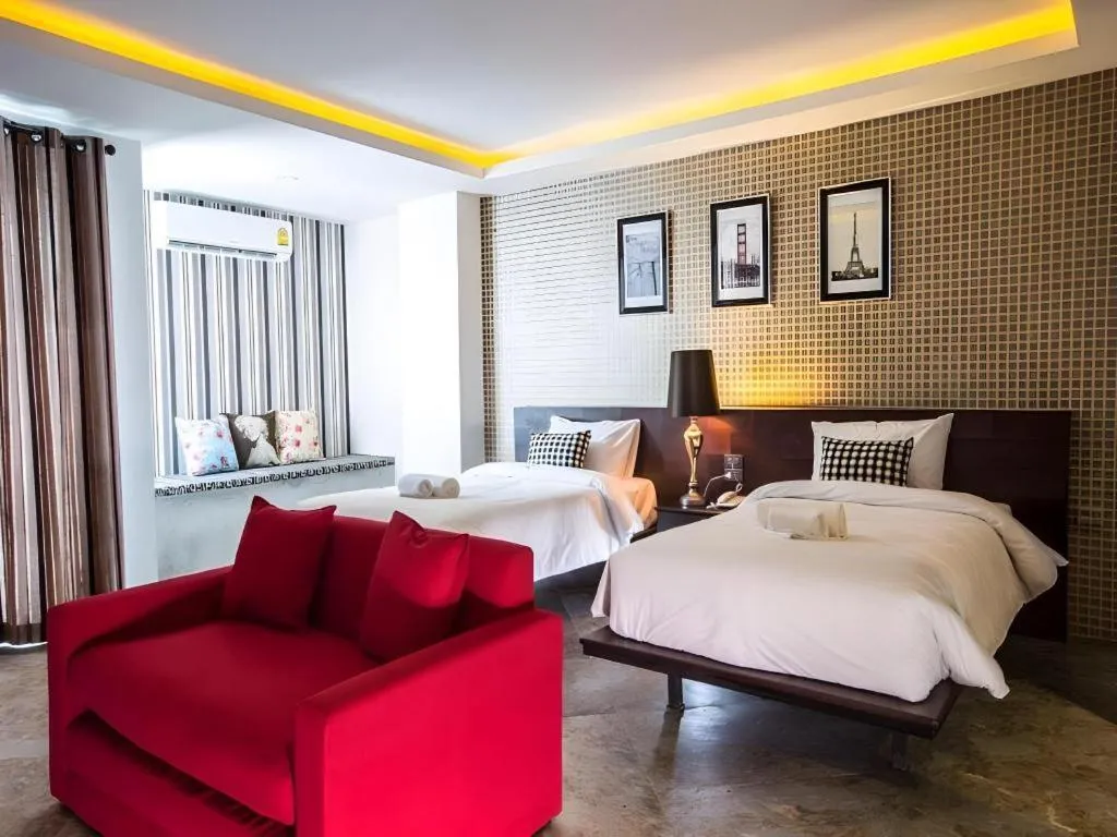 Bed in M Boutique Resort