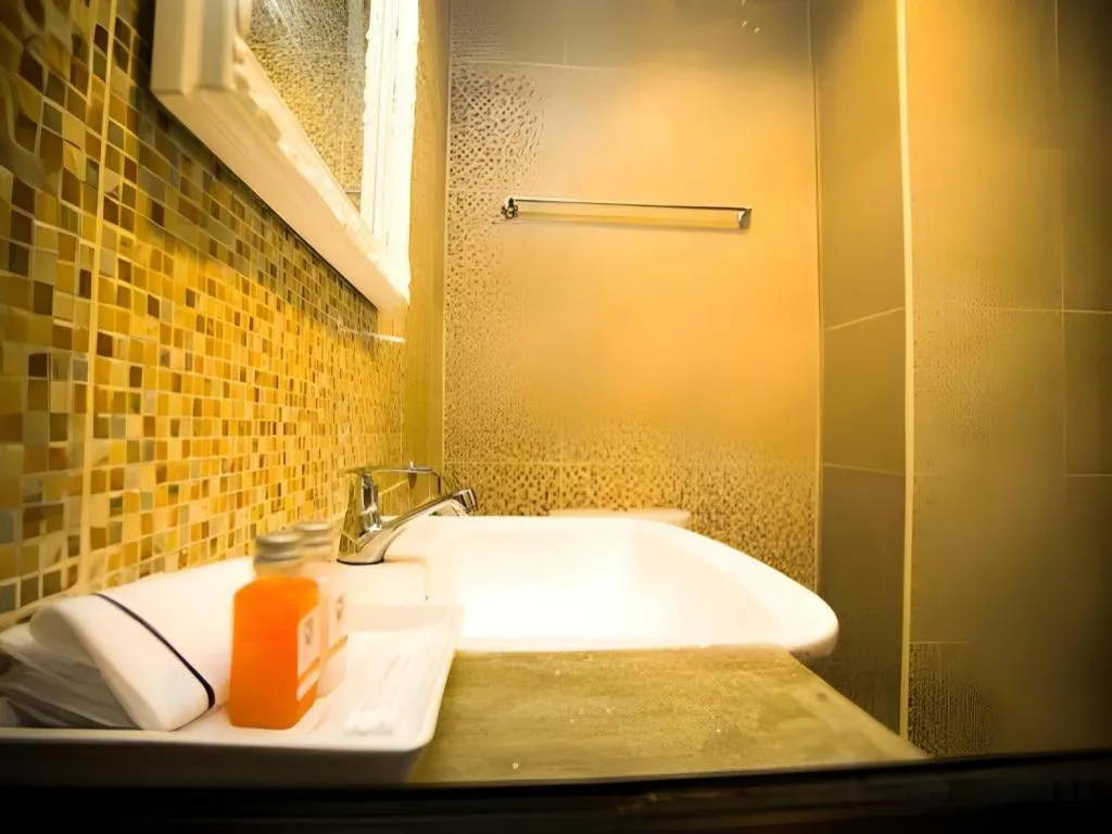 Bed in M Boutique Resort