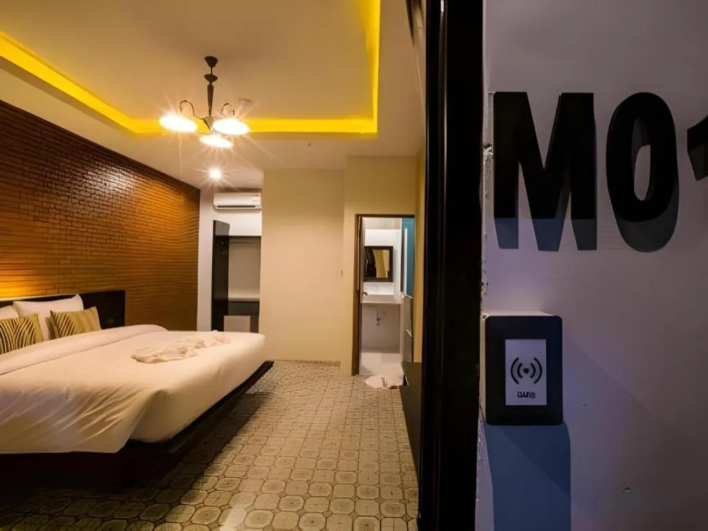 Bed in M Boutique Resort