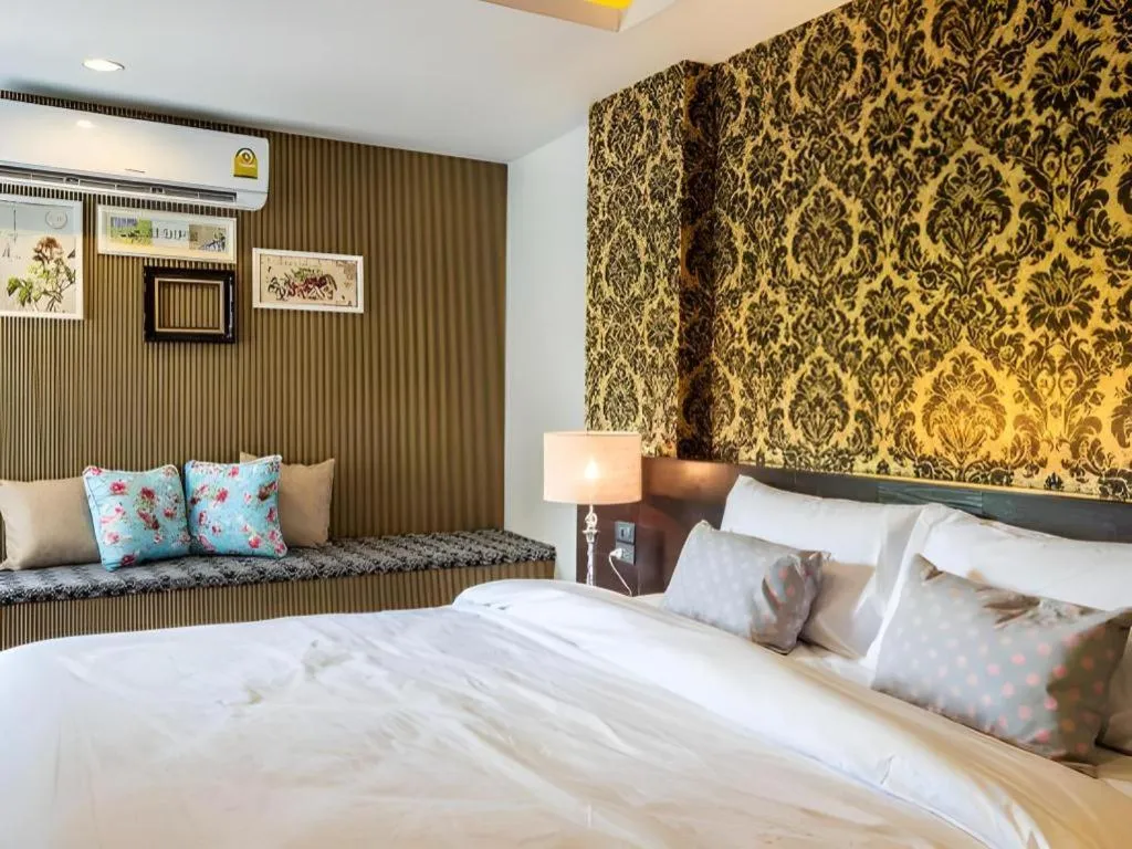 Bed in M Boutique Resort