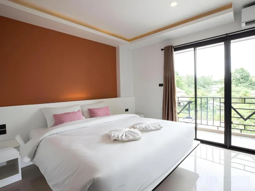 Bed in M Boutique Resort