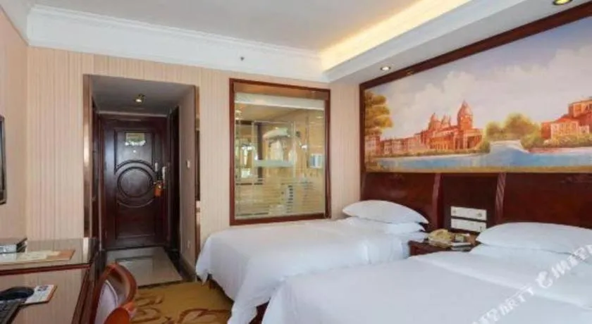 Bed in Vienna Hotel Nanning Train Station