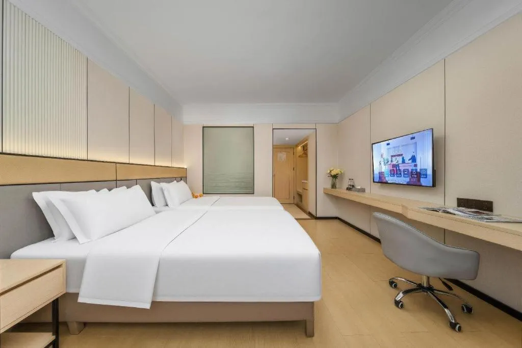 Bed in Vienna Hotel Nanning Train Station