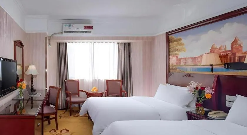 Bed in Vienna Hotel Nanning Train Station