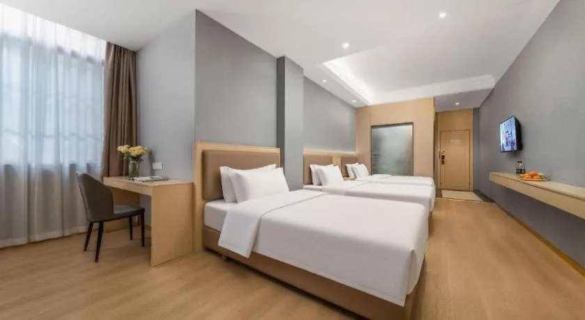 Bed in Vienna Hotel Nanning Train Station