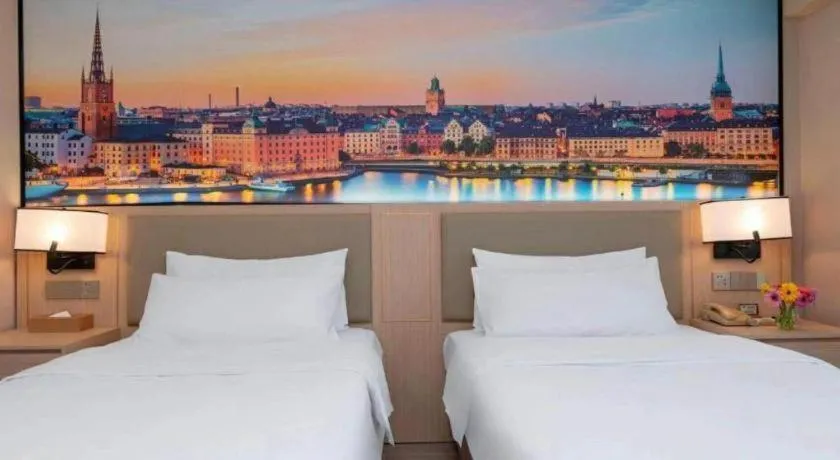 Bed in Vienna Hotel Nanning Train Station