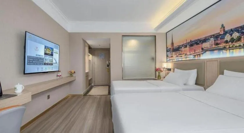 Bed in Vienna Hotel Nanning Train Station