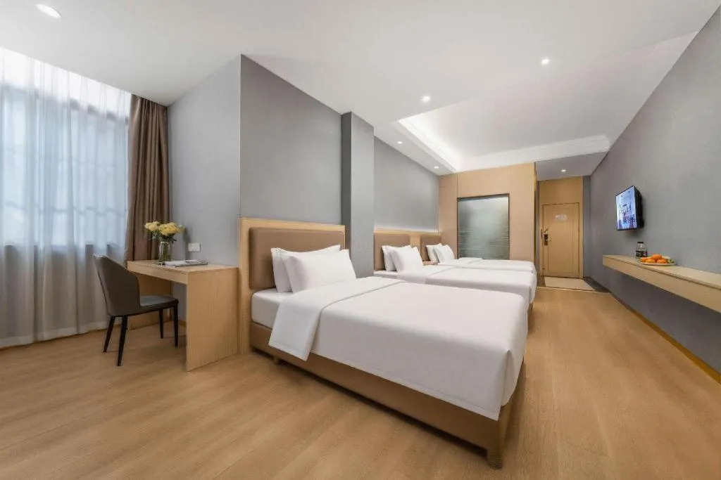 Bed in Vienna Hotel Nanning Train Station