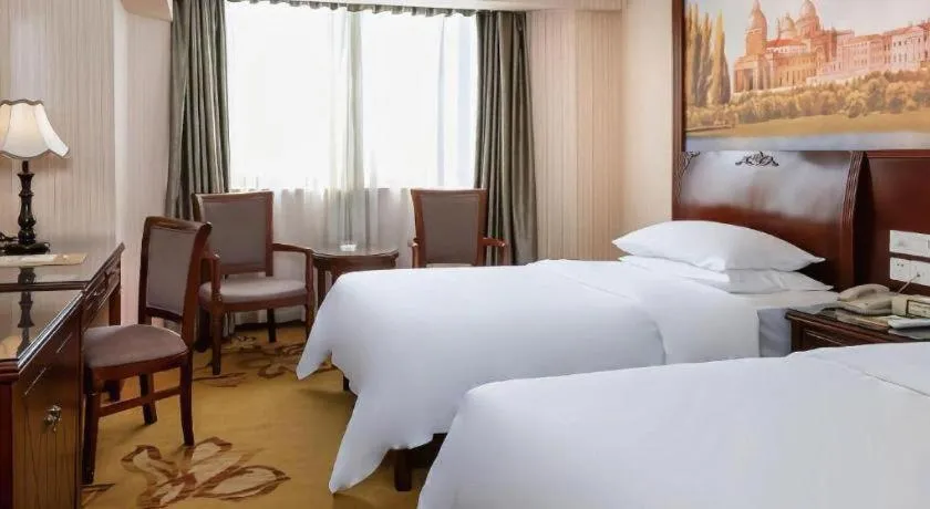 Bed in Vienna Hotel Nanning Train Station