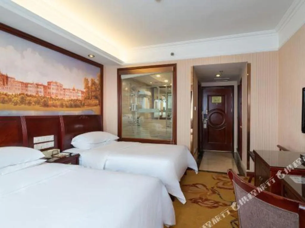 Bed in Vienna Hotel Nanning Train Station