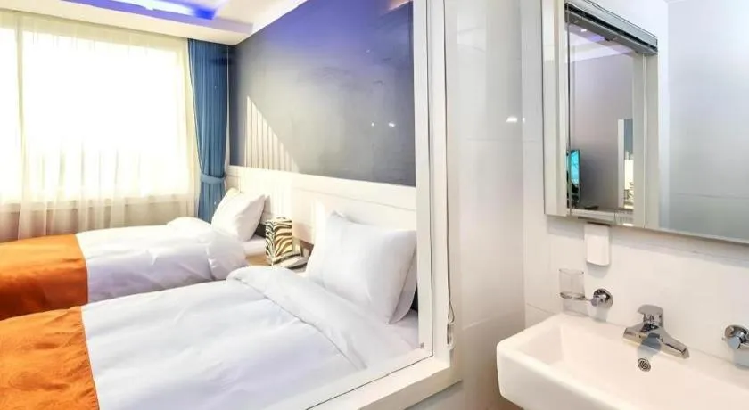 Bed in Galaxy Hotel