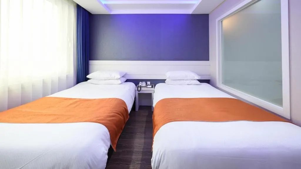 Bed in Galaxy Hotel