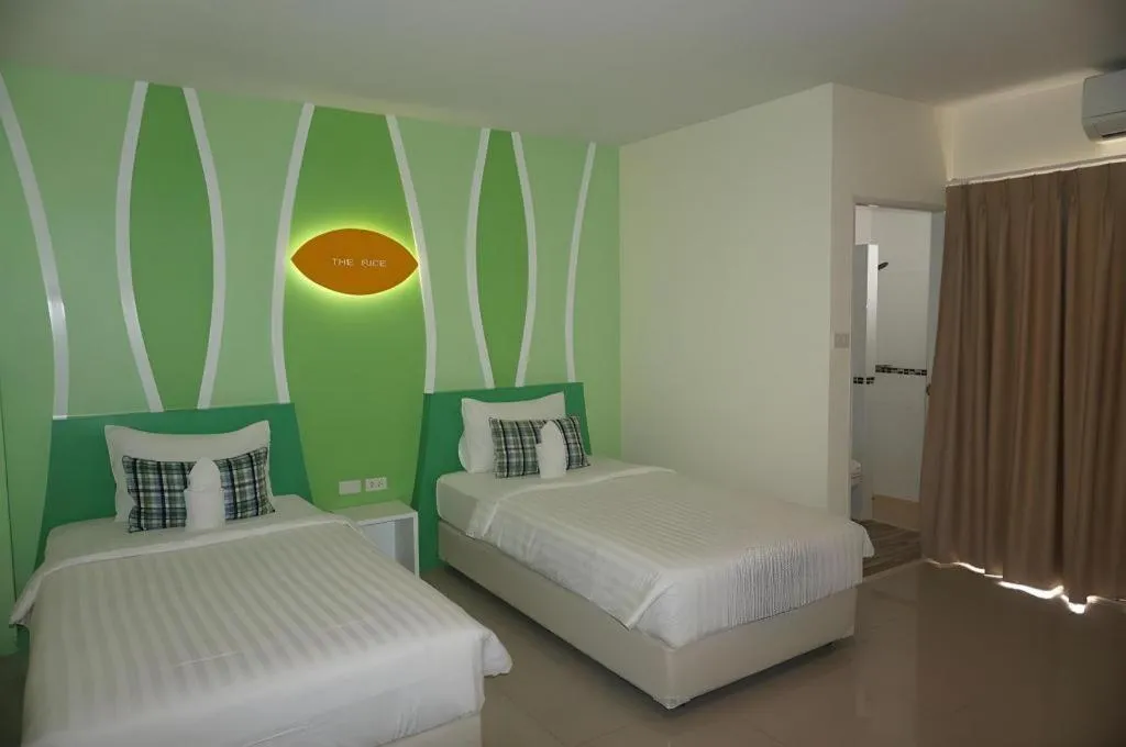 Bed in The Rice Hotel