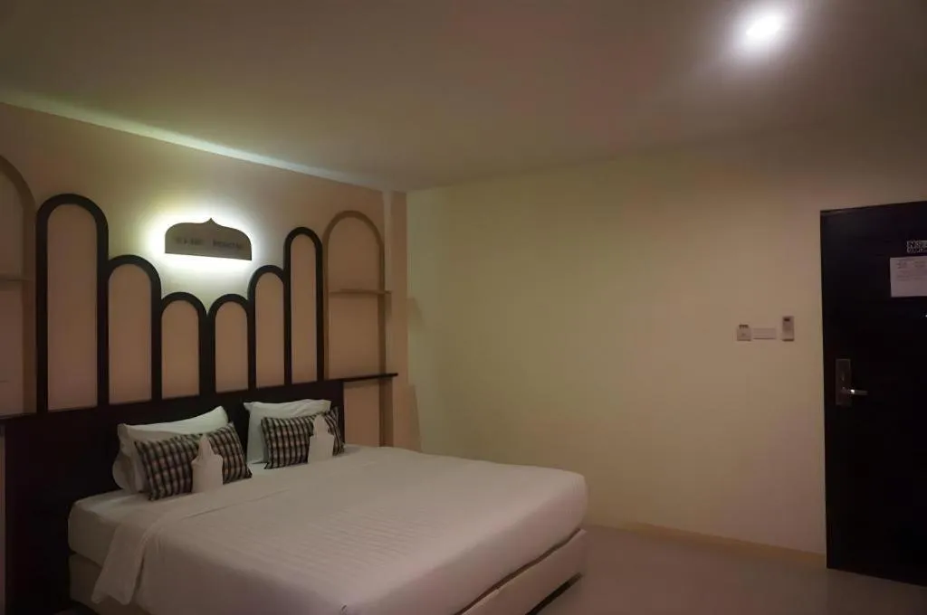 Bed in The Rice Hotel