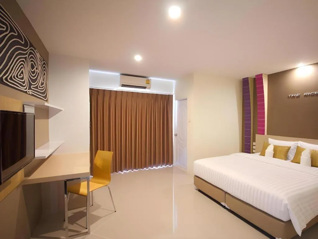 Bed in The Rice Hotel