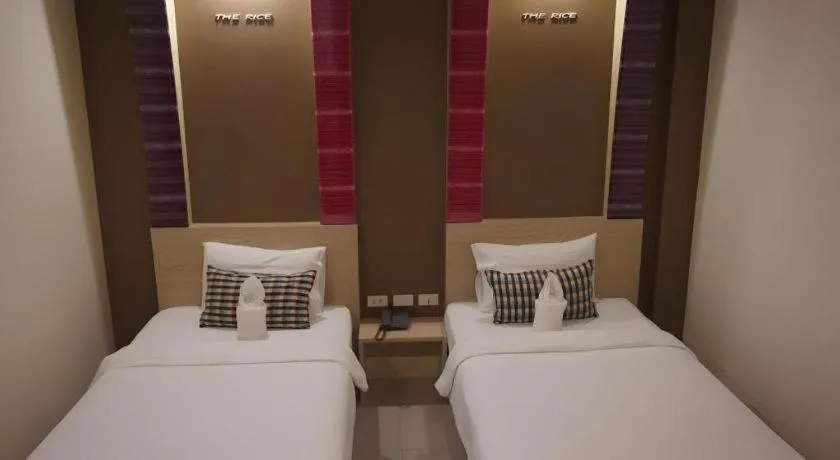 Bed in The Rice Hotel