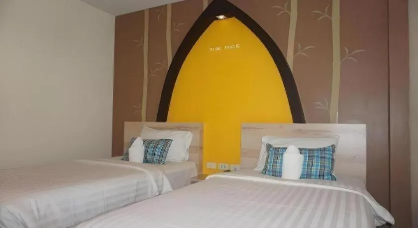 Bed in The Rice Hotel