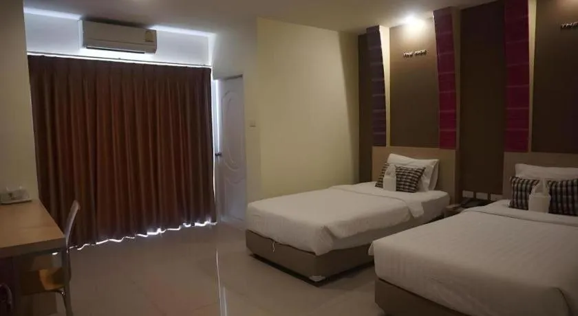 Bed in The Rice Hotel