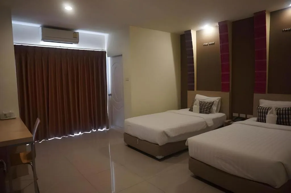 Bed in The Rice Hotel