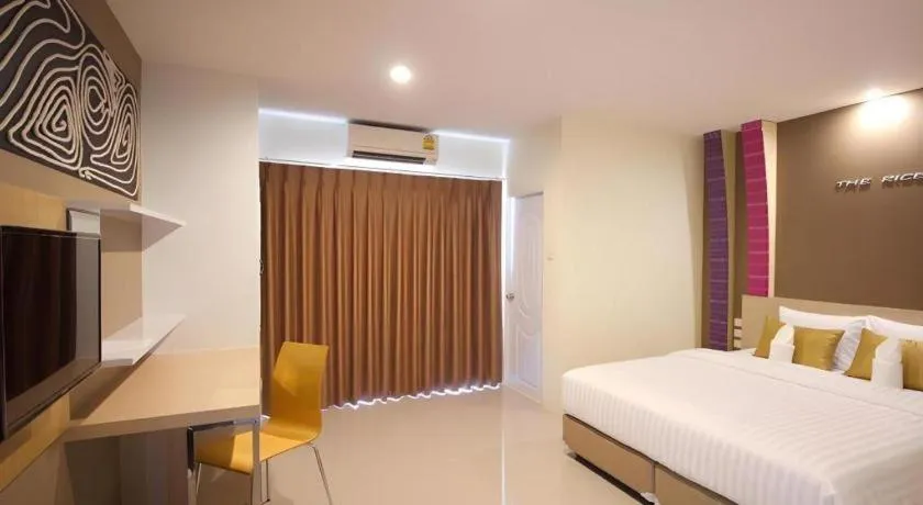 Bed in The Rice Hotel