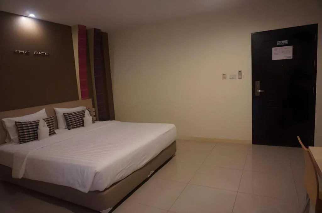 Bed in The Rice Hotel