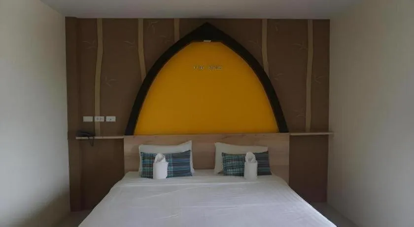 Bed in The Rice Hotel