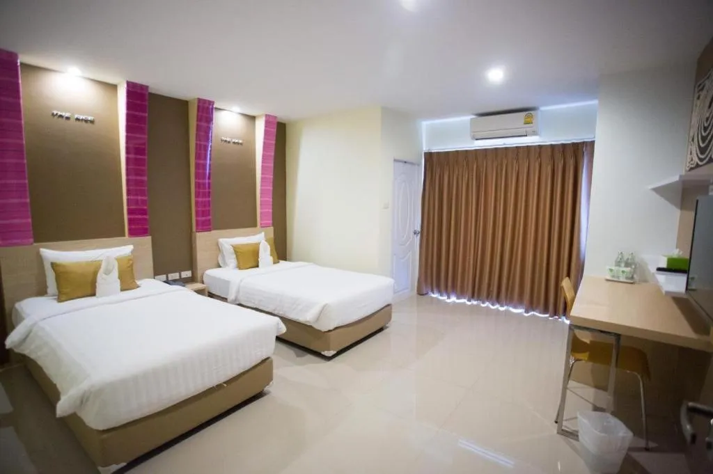 Bed in The Rice Hotel