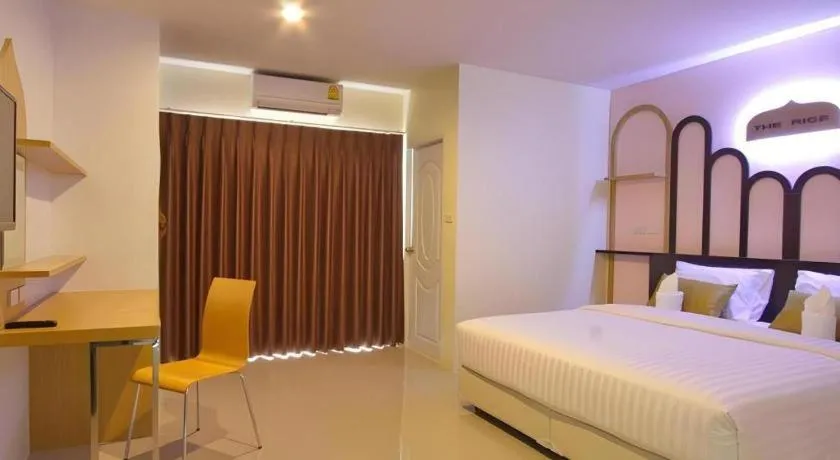 Bed in The Rice Hotel