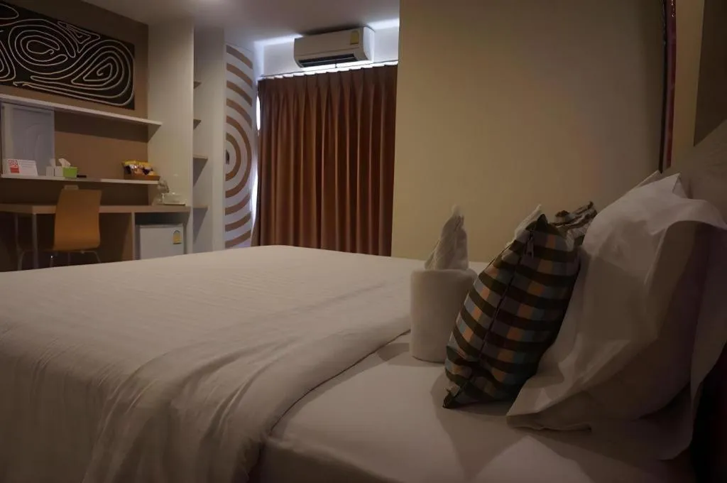 Bed in The Rice Hotel