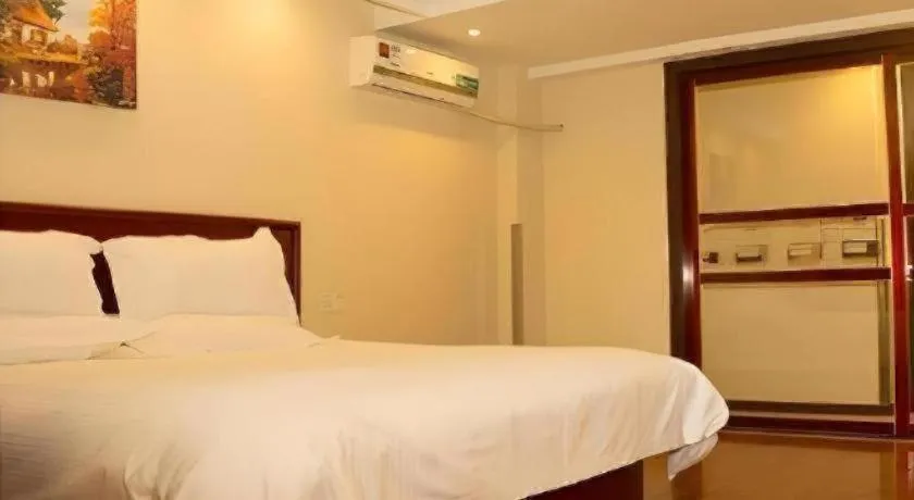 Bed in GreenTree Inn Lianyungang Guanyun Bus Station Zhenxing Garden Express Hotel