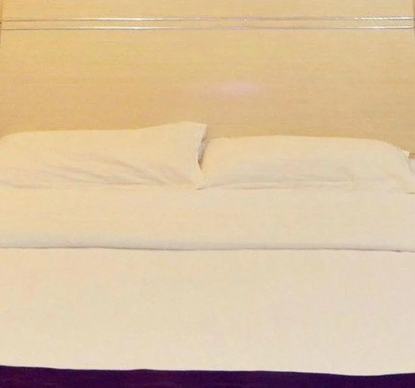 Bed in GreenTree Inn Lianyungang Guanyun Bus Station Zhenxing Garden Express Hotel