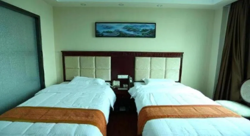 Bed in GreenTree Inn Guangzhou Baiyun International Airport Huaxi Road Express Hotel