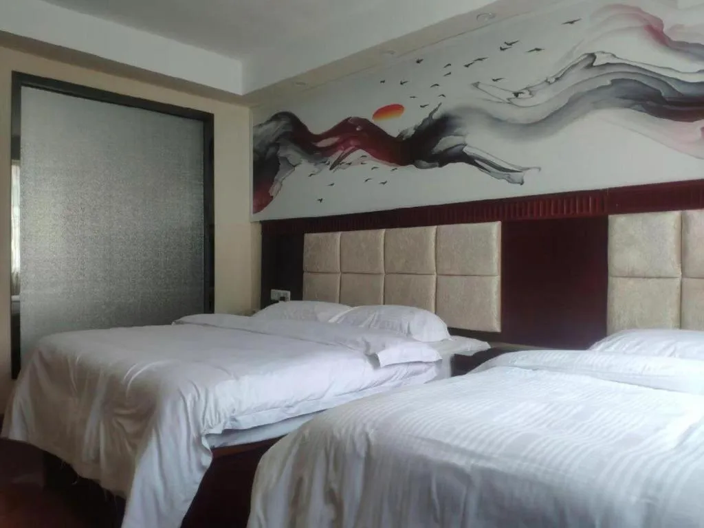 Bed in GreenTree Inn Guangzhou Baiyun International Airport Huaxi Road Express Hotel