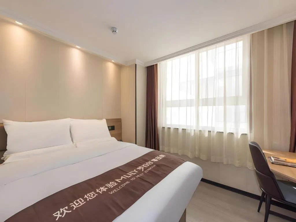 Bed in GreenTree Inn West Railway Station North Square Hotel