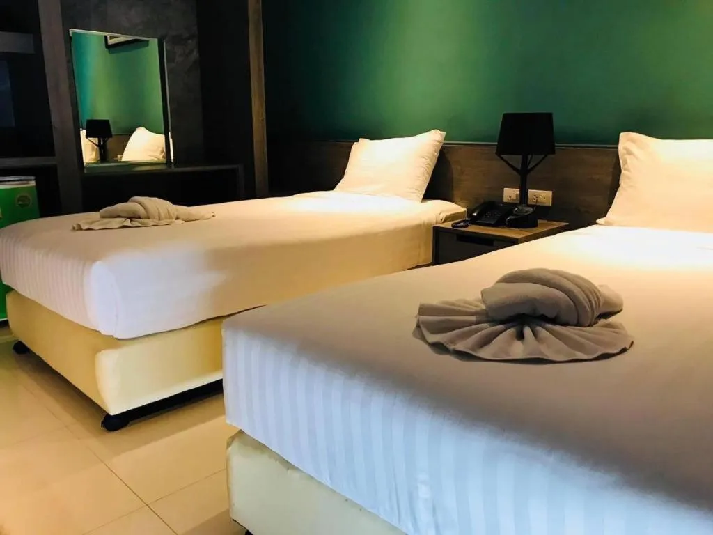 Bed in The Peak Boutique Hotel