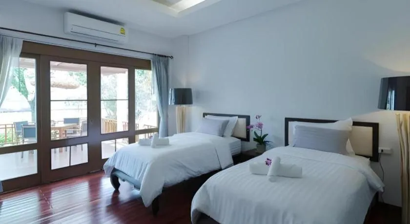 Bed in Doltara Boutique Resort