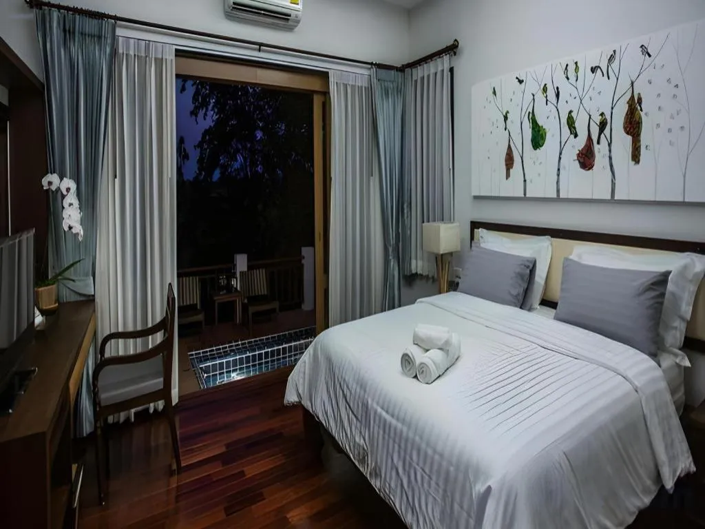 Bed in Doltara Boutique Resort