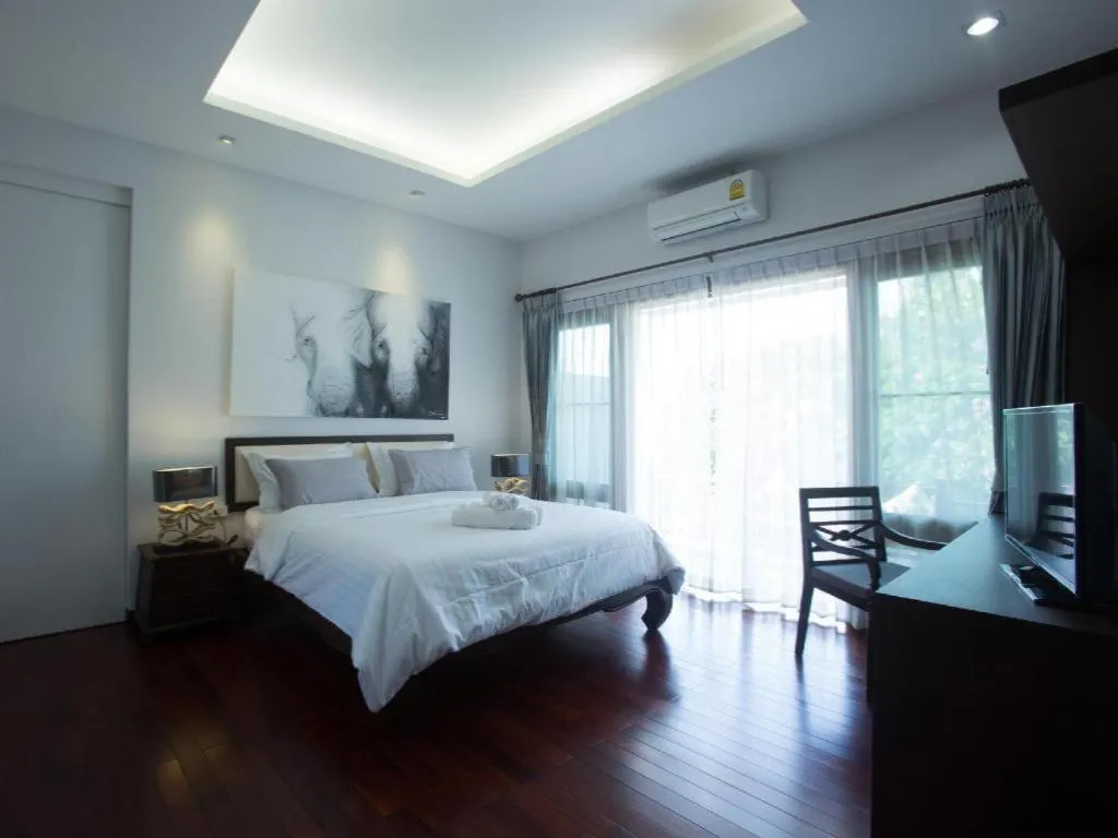 Bed in Doltara Boutique Resort