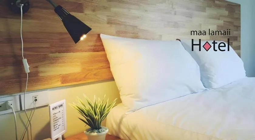 Bed in Maalamaii Hotel