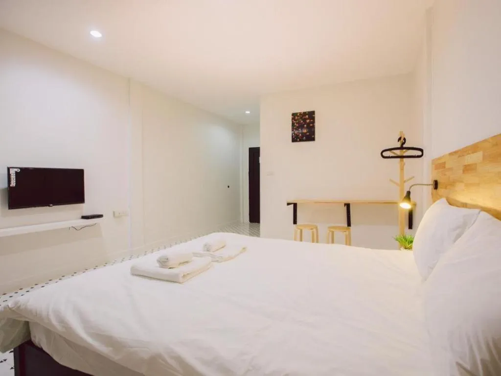 Bed in Maalamaii Hotel