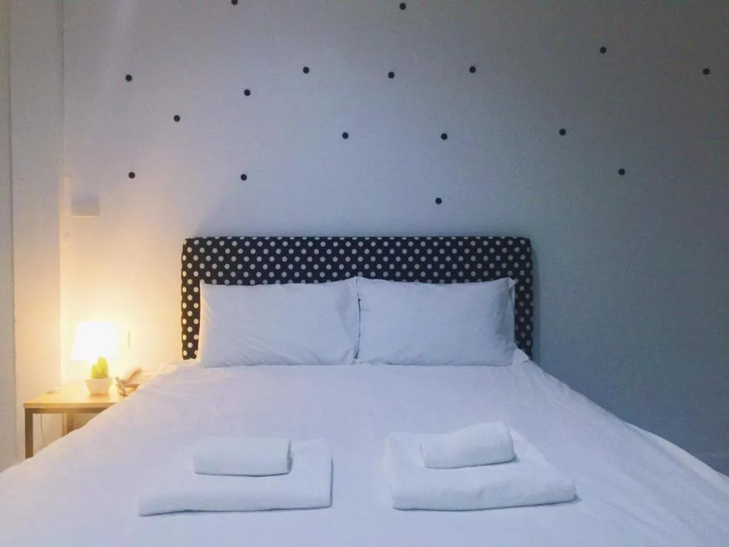 Bed in Maalamaii Hotel