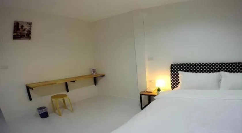 Bed in Maalamaii Hotel