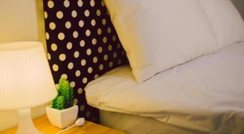 Bed in Maalamaii Hotel